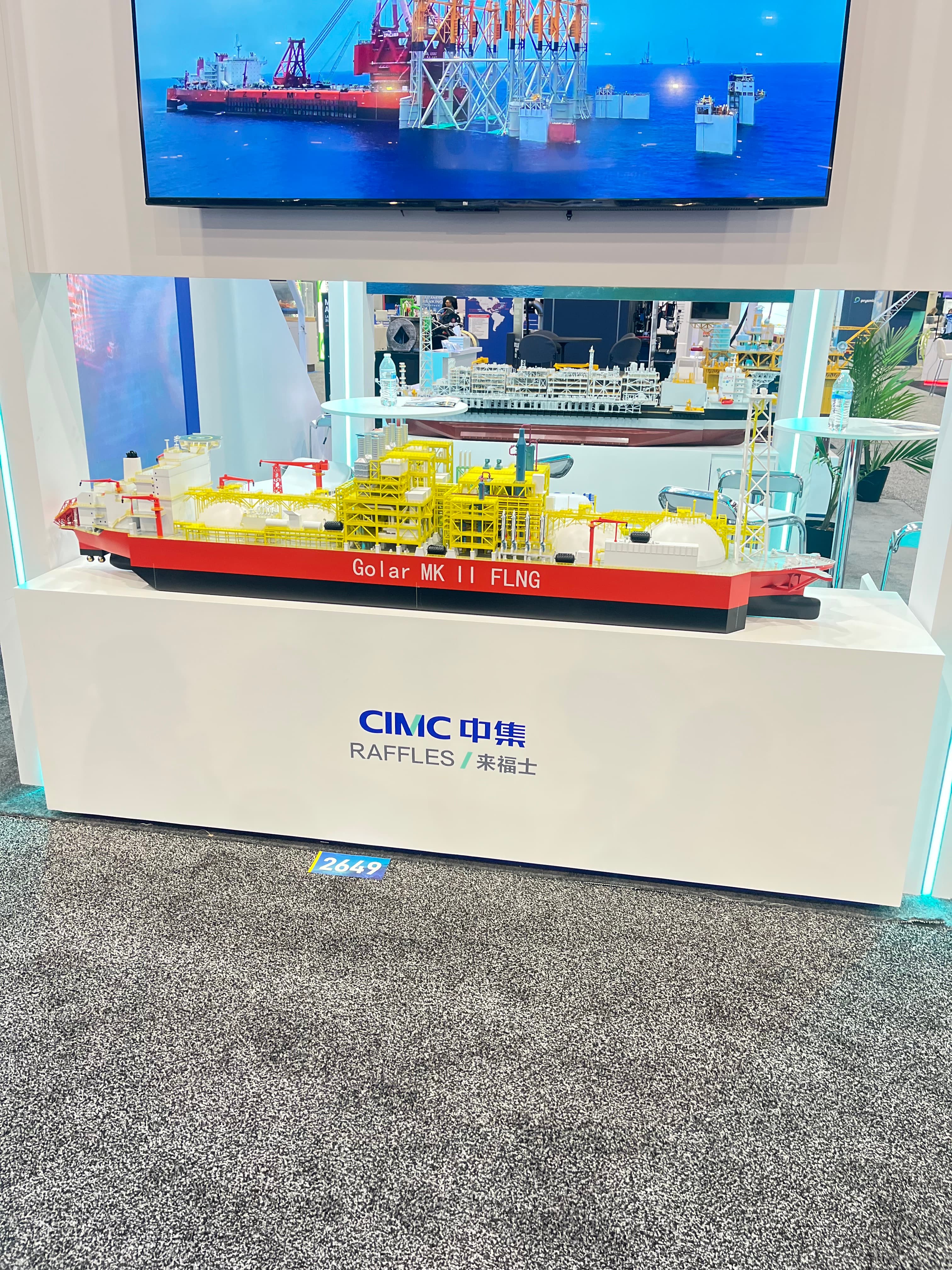 Scale model of the Golar MK II FLNG vessel on a CIMC Raffles display stand.